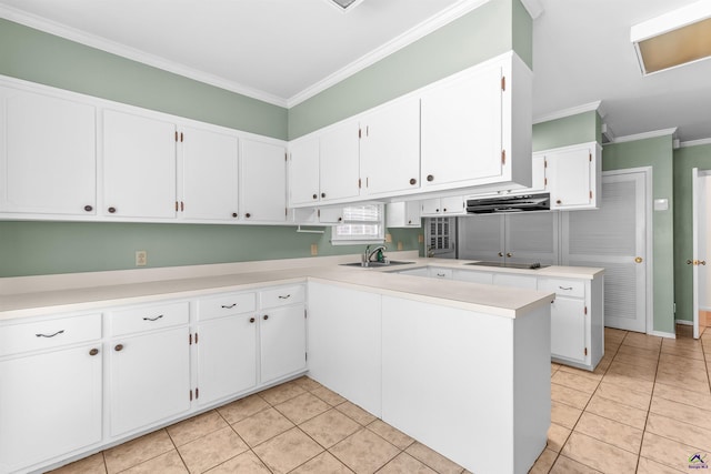 kitchen featuring kitchen peninsula, crown molding, sink, light tile patterned floors, and white cabinets