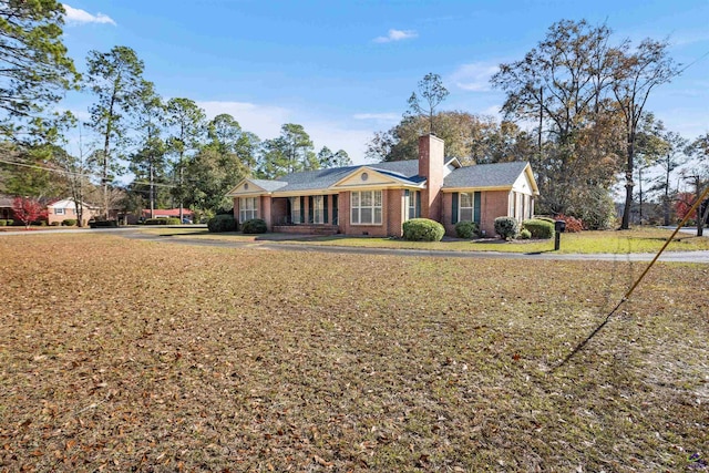 ranch-style home featuring a front yard