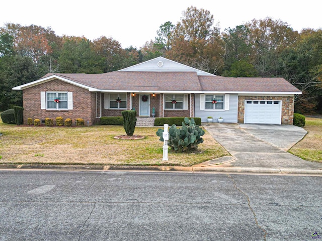 single story home featuring a garage and a front lawn