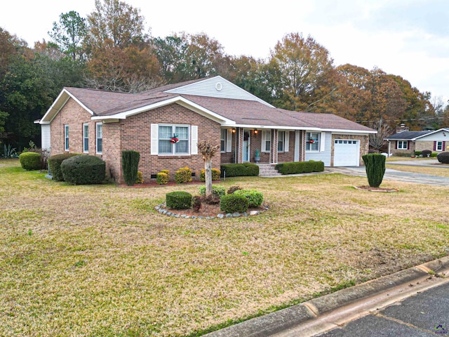 ranch-style house with a front lawn, covered porch, and a garage