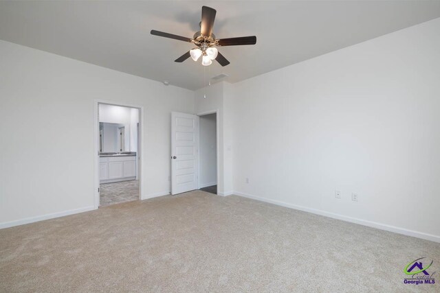 unfurnished bedroom with ceiling fan and light carpet