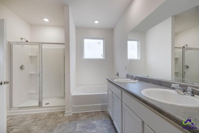 bathroom with vanity and separate shower and tub