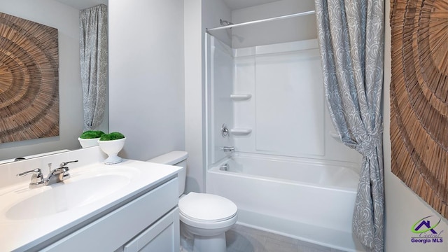 full bathroom with vanity, shower / tub combo, and toilet