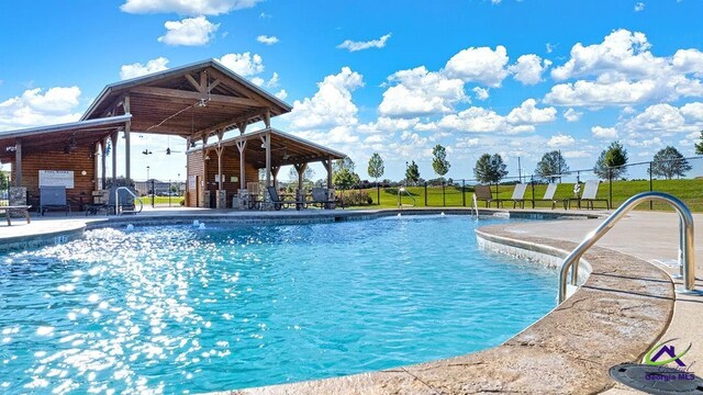 view of swimming pool featuring a patio area