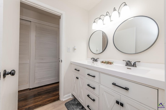 bathroom with vanity and hardwood / wood-style flooring