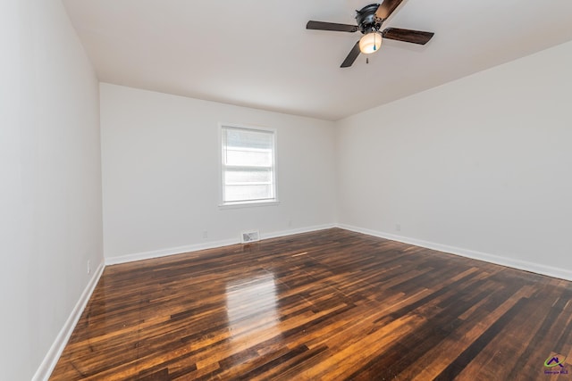 empty room featuring dark hardwood / wood-style floors and ceiling fan