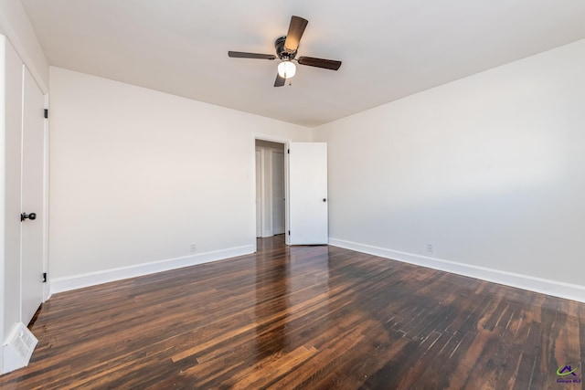 spare room featuring ceiling fan and dark hardwood / wood-style floors