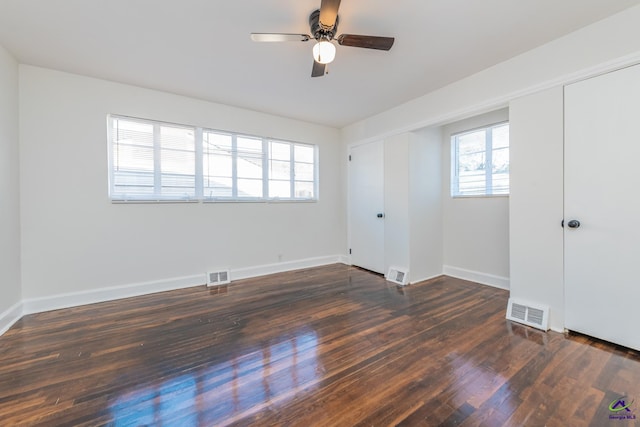 interior space featuring ceiling fan and dark wood-type flooring