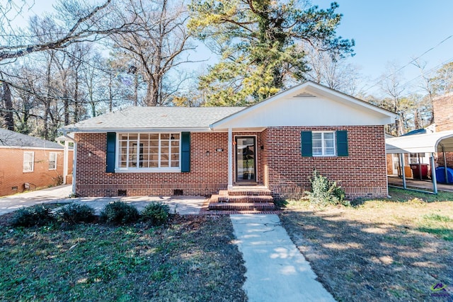 view of front of property with a carport