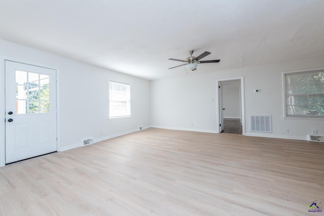 interior space featuring a wealth of natural light, light hardwood / wood-style flooring, and ceiling fan