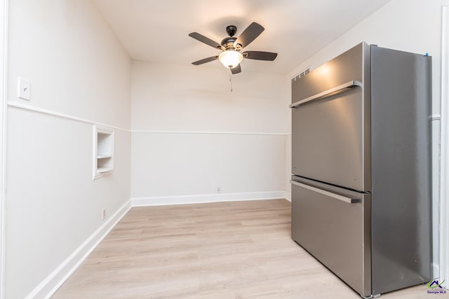 kitchen with stainless steel fridge, light hardwood / wood-style floors, ceiling fan, and built in shelves