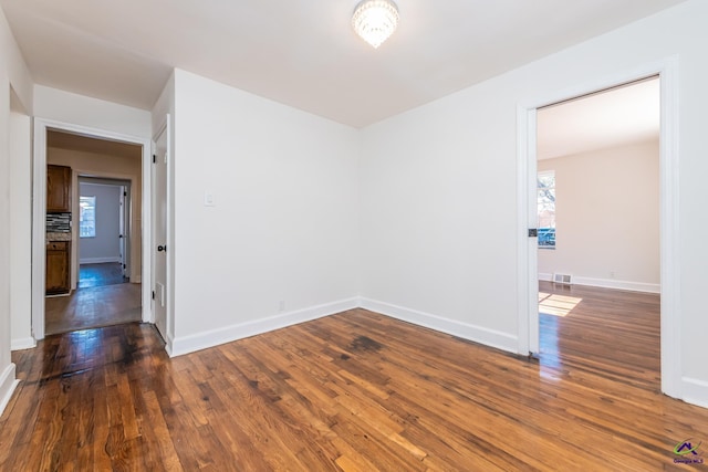 empty room featuring dark hardwood / wood-style floors