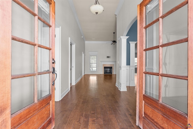 hall featuring dark hardwood / wood-style floors and ornamental molding