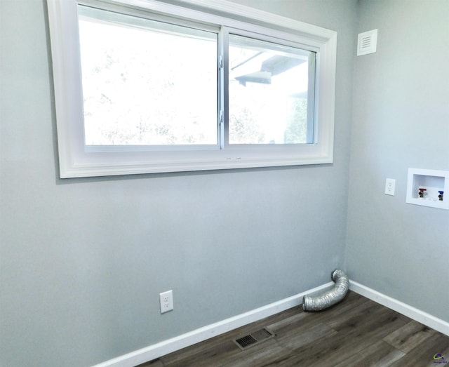 clothes washing area featuring washer hookup and dark hardwood / wood-style floors