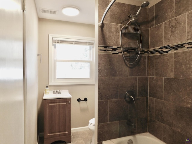 full bathroom featuring tile patterned flooring, vanity, toilet, and tiled shower / bath