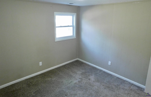 unfurnished room featuring carpet flooring