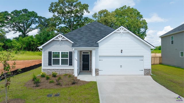 view of front facade with a garage and a front yard