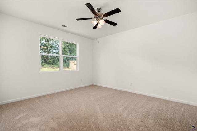 carpeted empty room with ceiling fan