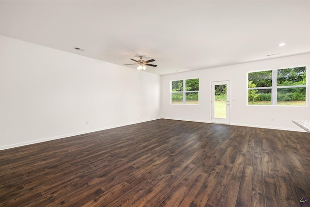 unfurnished room with ceiling fan and dark hardwood / wood-style flooring