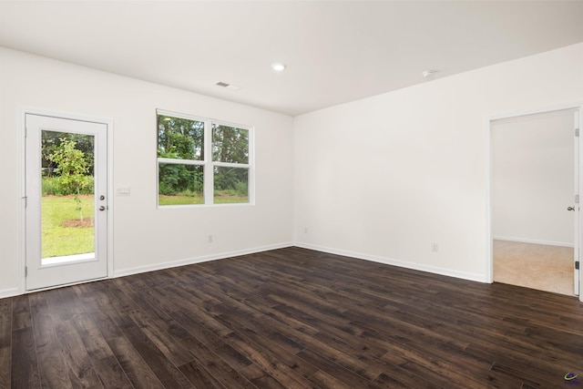 spare room featuring dark hardwood / wood-style flooring