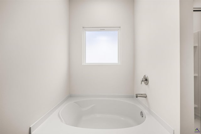 bathroom with a washtub