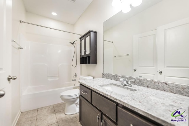 full bathroom featuring tile patterned floors, vanity, toilet, and bathing tub / shower combination