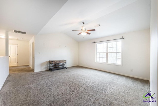 unfurnished living room with carpet, vaulted ceiling, and ceiling fan