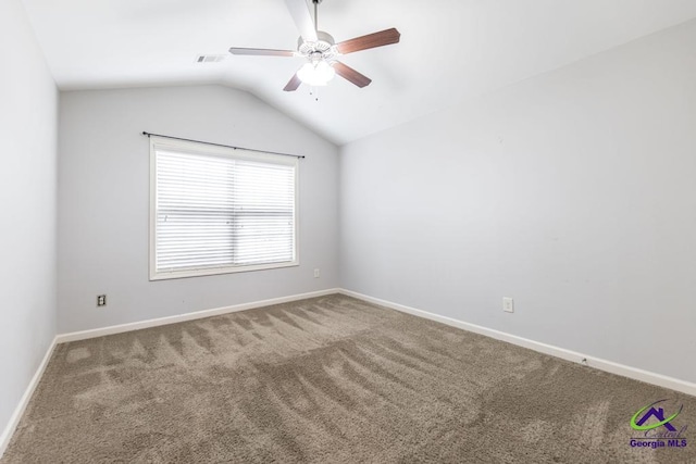 empty room with ceiling fan, carpet, and lofted ceiling