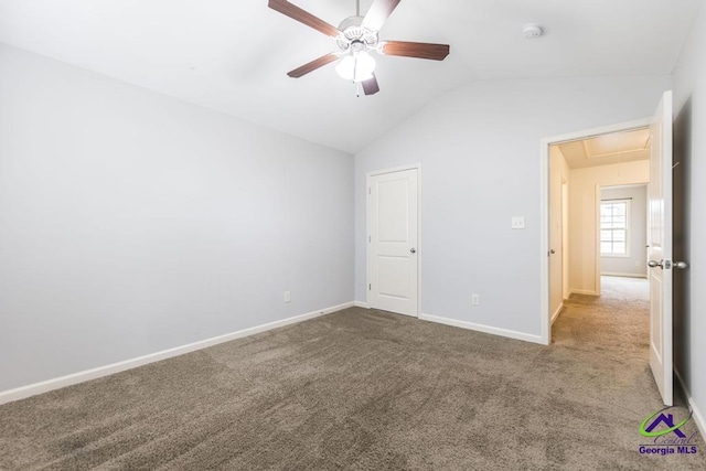 unfurnished bedroom featuring ceiling fan, carpet floors, and lofted ceiling