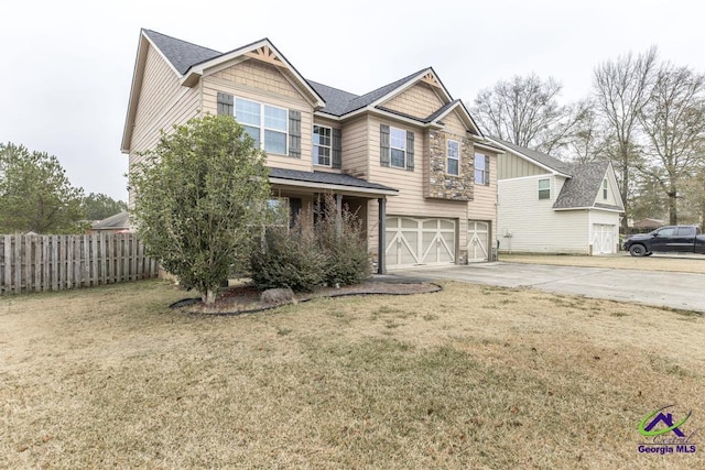 view of front facade with a garage and a front yard