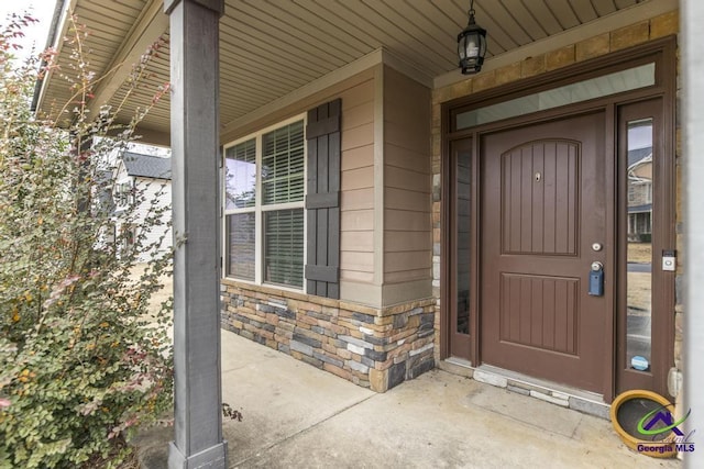 property entrance featuring covered porch