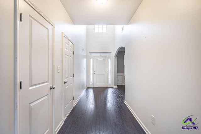 corridor featuring dark wood-type flooring