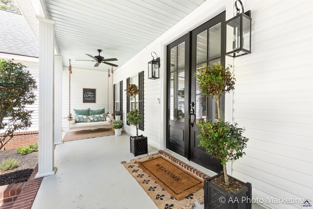 doorway to property featuring ceiling fan