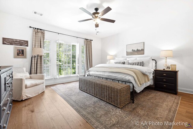 bedroom featuring hardwood / wood-style flooring and ceiling fan