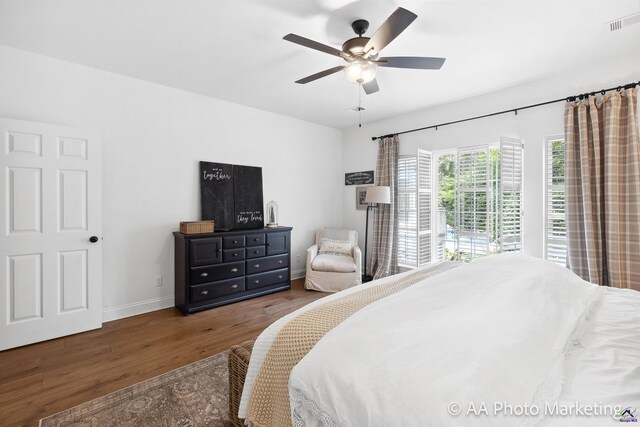 bedroom featuring dark hardwood / wood-style flooring and ceiling fan