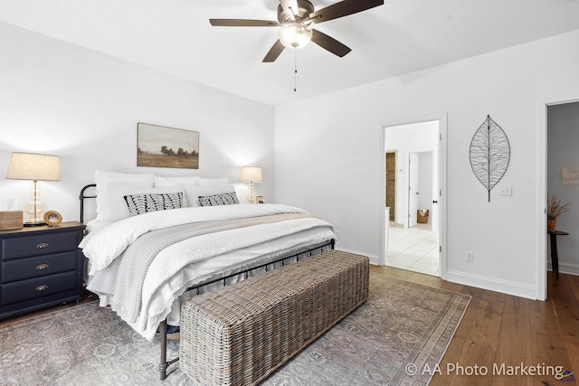 bedroom featuring ensuite bathroom, ceiling fan, and dark hardwood / wood-style floors