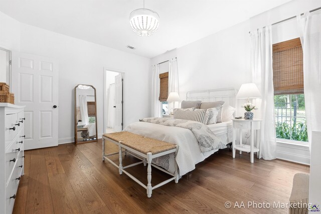 bedroom featuring dark hardwood / wood-style flooring