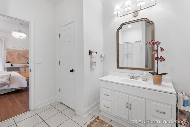 bathroom with tile patterned floors, vanity, and a shower with curtain