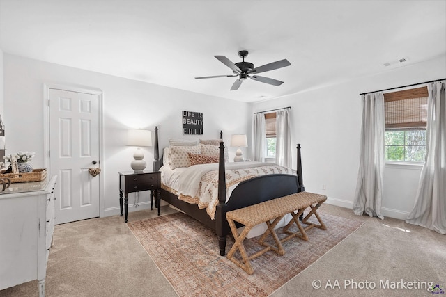 bedroom featuring ceiling fan and light carpet