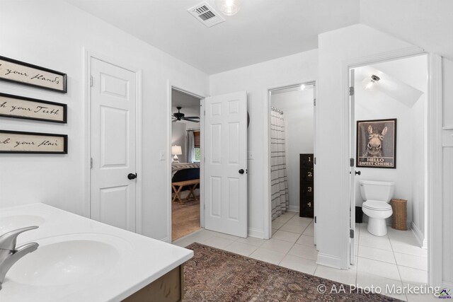 bathroom featuring tile patterned flooring, ceiling fan, toilet, and vanity