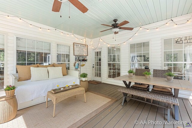 sunroom featuring wooden ceiling