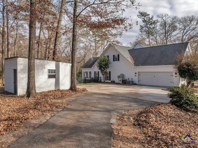 view of side of property with a garage