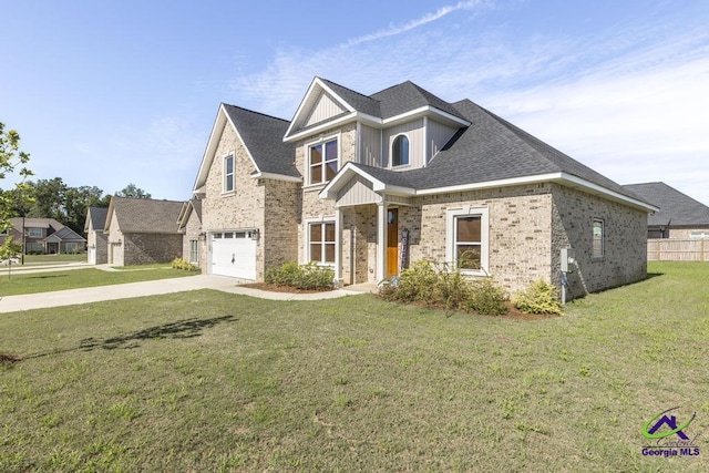 view of front of home with a front lawn and a garage