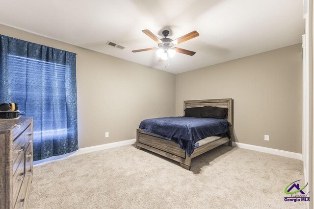 bedroom with light colored carpet and ceiling fan