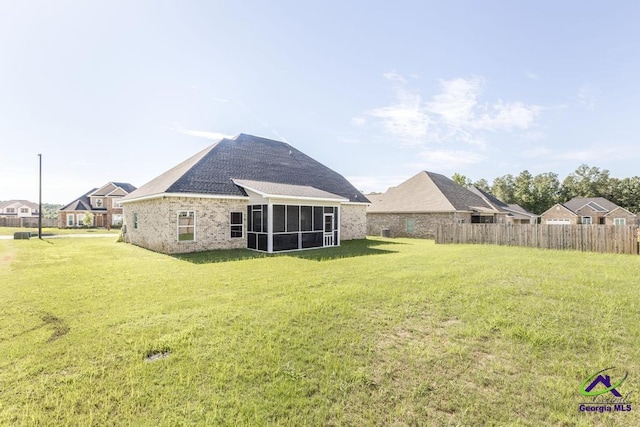 view of yard with a sunroom