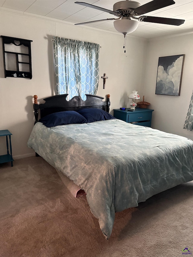 bedroom featuring ornamental molding, carpet, and ceiling fan