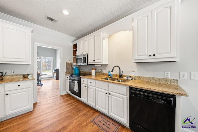 kitchen featuring white cabinetry, sink, a textured ceiling, black appliances, and ornamental molding