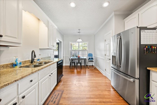 kitchen featuring sink, dishwasher, stainless steel fridge with ice dispenser, white cabinetry, and hanging light fixtures