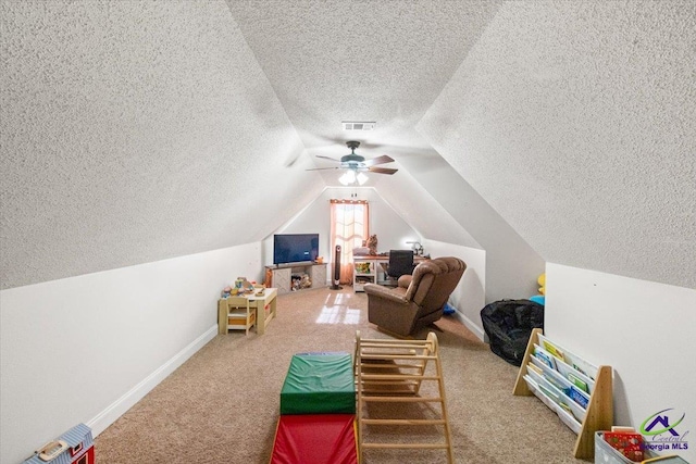 rec room featuring carpet floors, vaulted ceiling, and ceiling fan