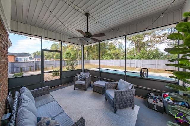 sunroom / solarium with plenty of natural light and ceiling fan